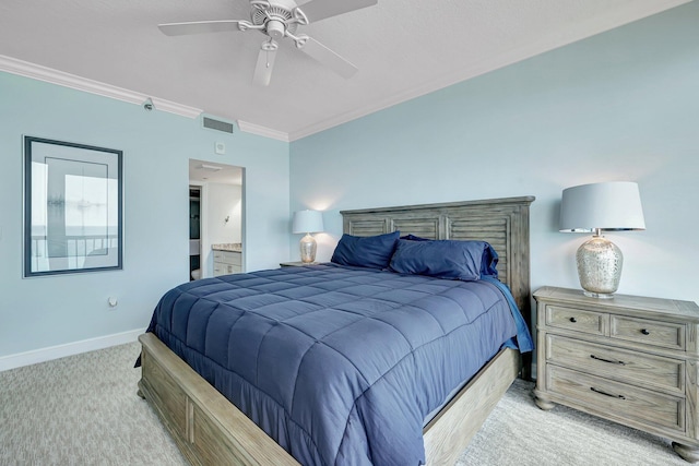 carpeted bedroom featuring ornamental molding, ceiling fan, and ensuite bath