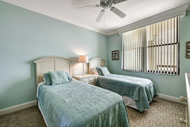 carpeted bedroom with ceiling fan and ornamental molding