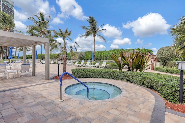 view of pool with a patio and a community hot tub