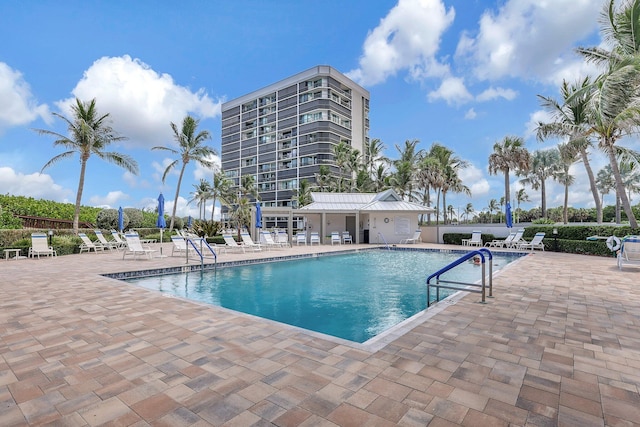 view of swimming pool with a patio