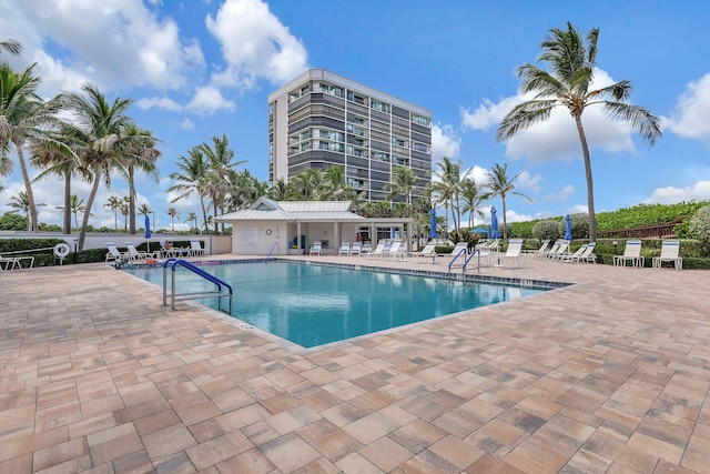 view of swimming pool with a patio