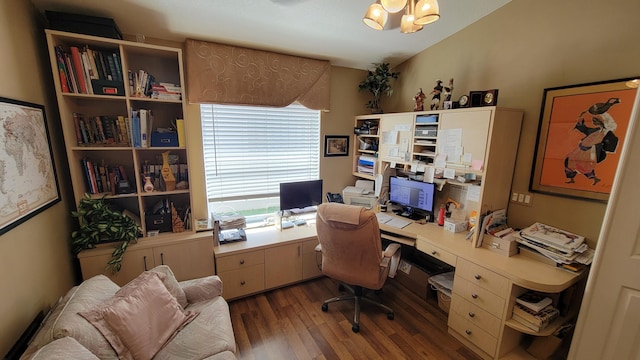 office with dark hardwood / wood-style floors, built in desk, and an inviting chandelier