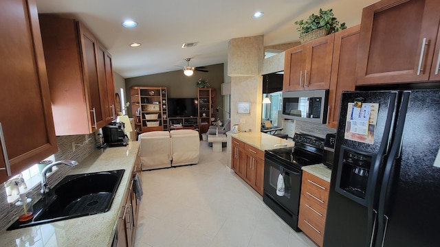 kitchen featuring black appliances, ceiling fan, lofted ceiling, light tile patterned floors, and backsplash