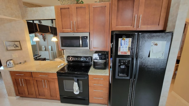 kitchen featuring backsplash, black appliances, light tile patterned floors, and light stone counters