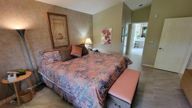 bedroom featuring tile patterned flooring and vaulted ceiling