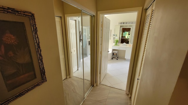 hall with light tile patterned flooring