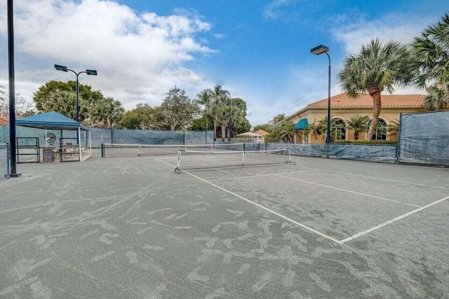 view of tennis court featuring a gazebo