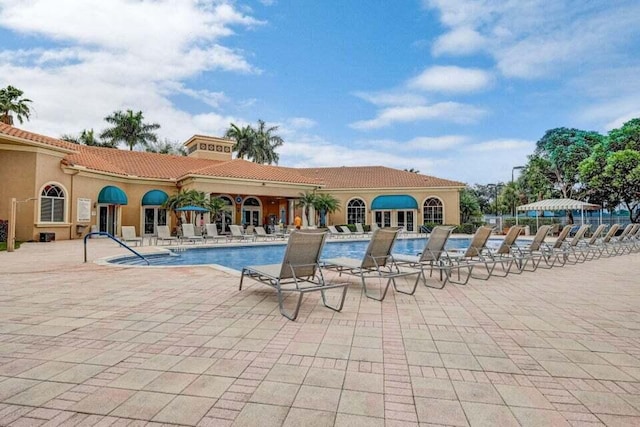 view of swimming pool with a patio