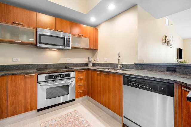 kitchen featuring sink, appliances with stainless steel finishes, and light tile patterned floors