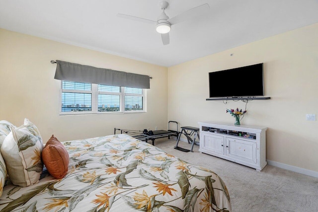 bedroom with ceiling fan and light colored carpet