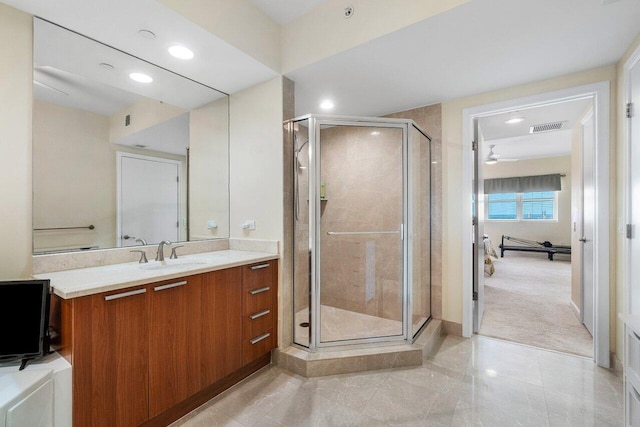 bathroom with vanity and an enclosed shower