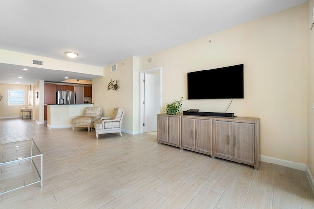 living room with light hardwood / wood-style floors