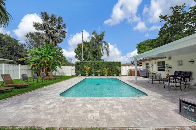 view of swimming pool with a patio