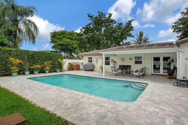 view of pool featuring a patio