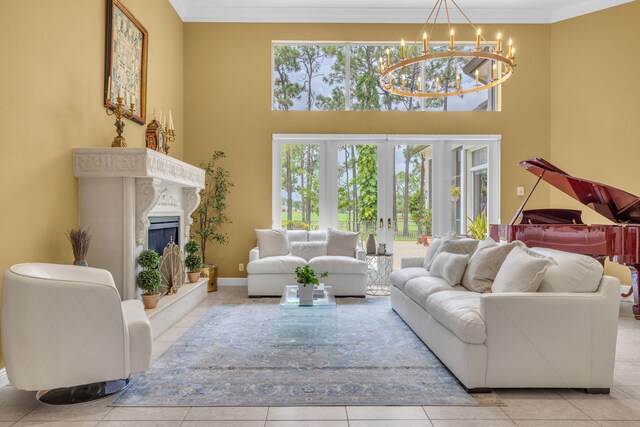 tiled living room with crown molding, a chandelier, and a high ceiling