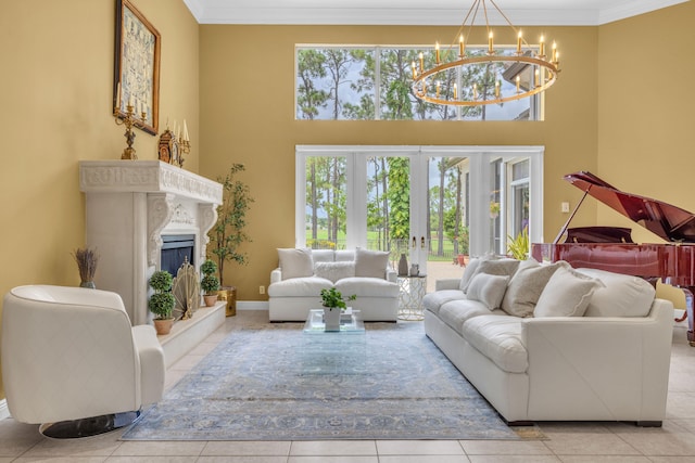 tiled living room with crown molding, a towering ceiling, a premium fireplace, and french doors