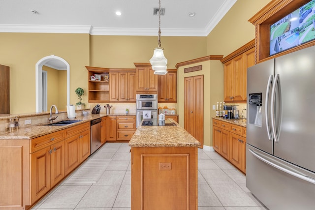 kitchen featuring sink, stainless steel appliances, light tile patterned flooring, decorative light fixtures, and kitchen peninsula