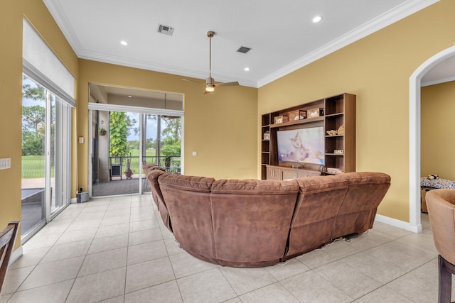 tiled living room with ornamental molding and built in shelves