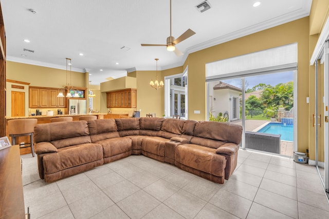 living room featuring light tile patterned floors, crown molding, and ceiling fan with notable chandelier