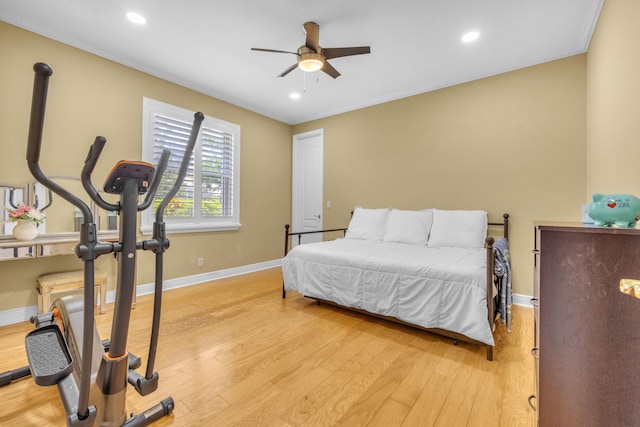 bedroom with ceiling fan and light hardwood / wood-style flooring