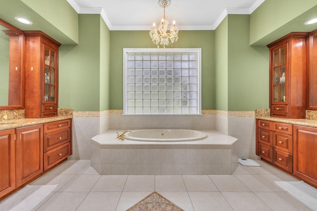 bathroom featuring tile patterned flooring, tiled bath, vanity, and ornamental molding