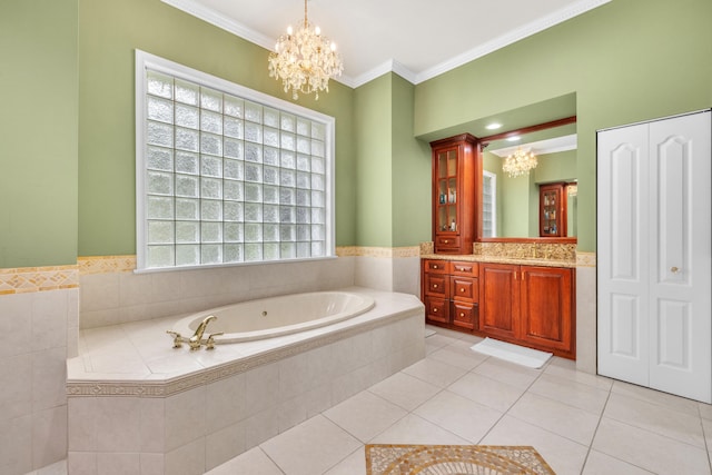 bathroom with a notable chandelier, vanity, tile patterned floors, crown molding, and a relaxing tiled tub