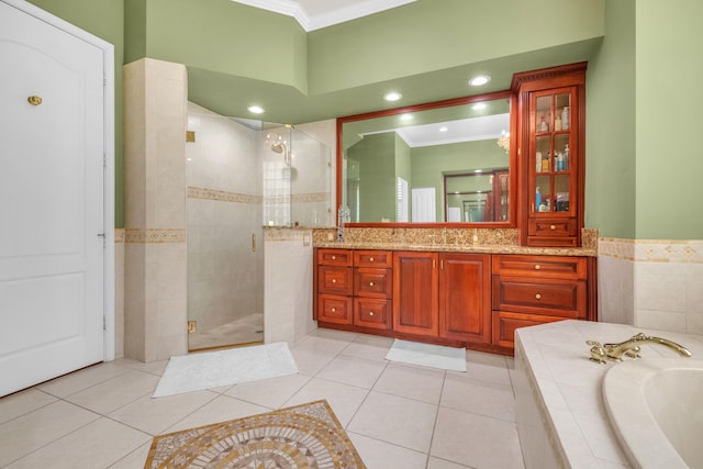 bathroom with crown molding, tile patterned floors, independent shower and bath, and vanity