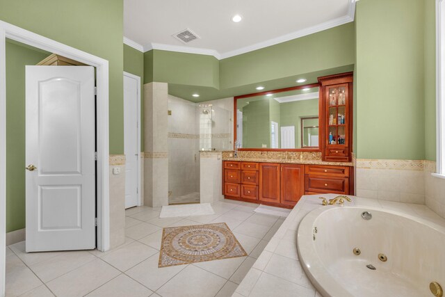 bathroom featuring a tile shower, tile patterned floors, vanity, and ornamental molding