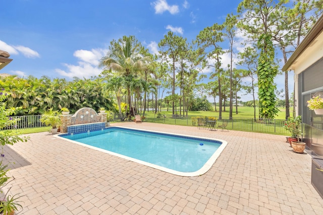 view of swimming pool with a patio