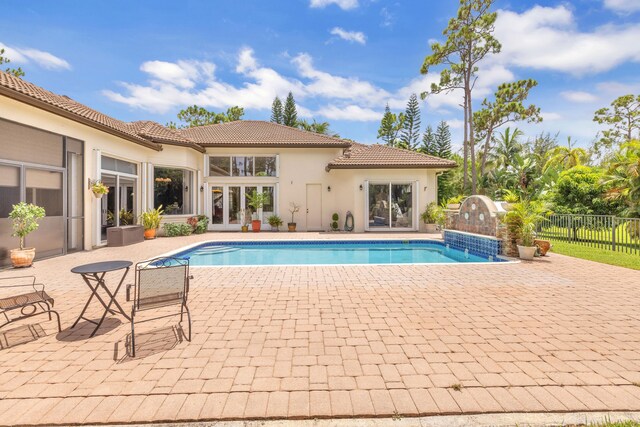 view of swimming pool with a patio area