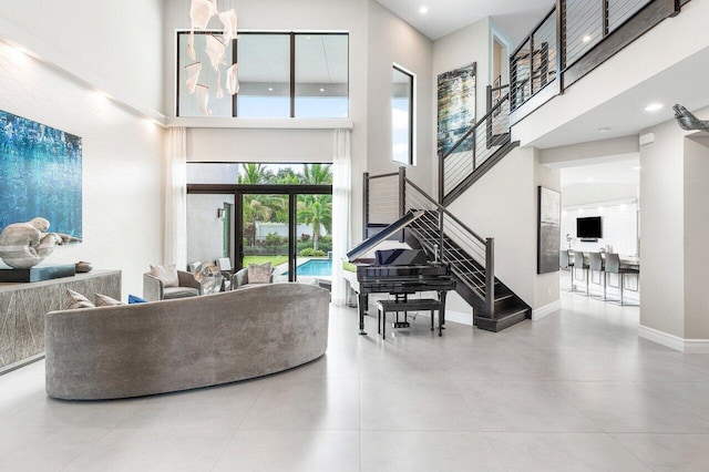 living room featuring a high ceiling