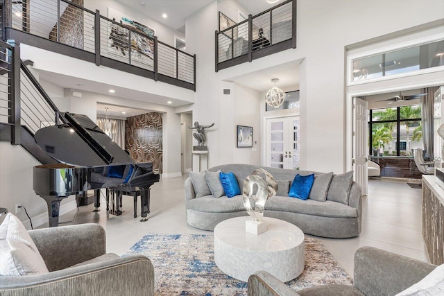 living room with french doors and a towering ceiling