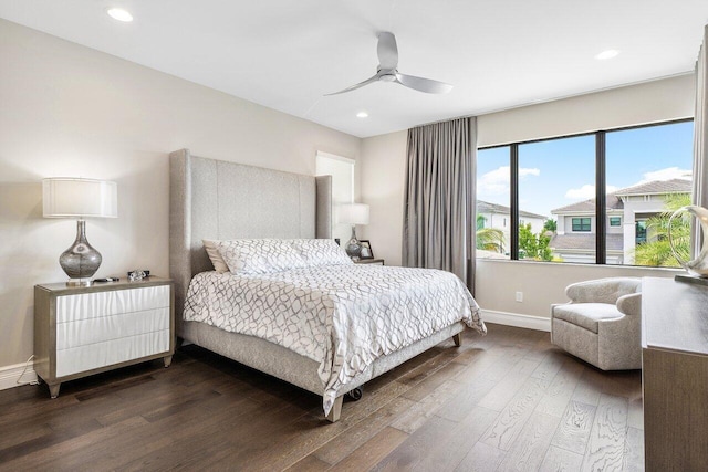 bedroom featuring ceiling fan and dark hardwood / wood-style flooring