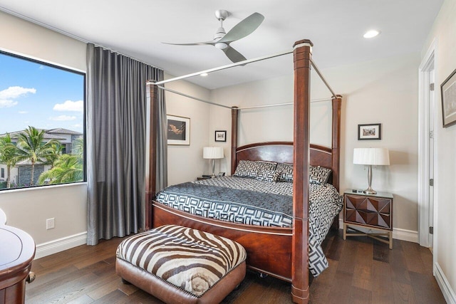 bedroom with dark wood-type flooring and ceiling fan