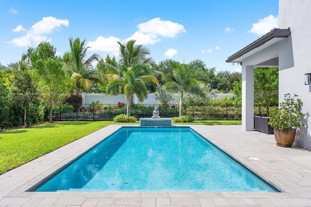 view of swimming pool with a patio and a lawn