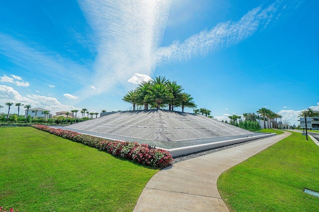 view of community featuring a lawn