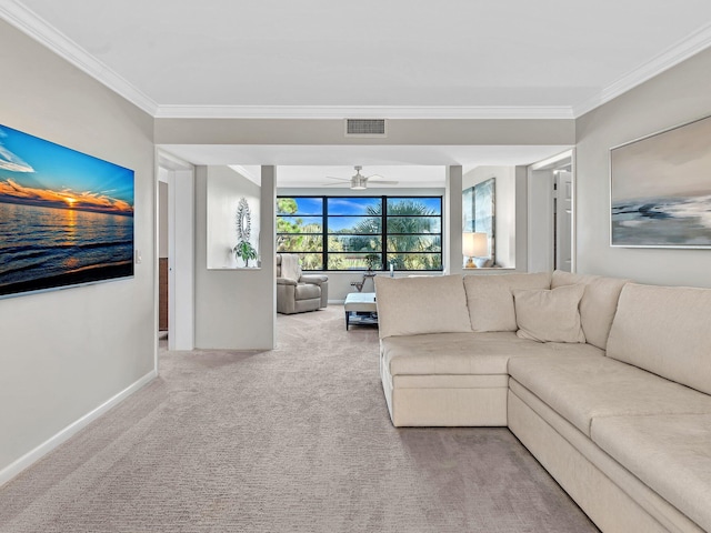 carpeted living room featuring ornamental molding and ceiling fan