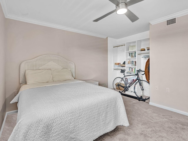 bedroom featuring crown molding, light colored carpet, and ceiling fan