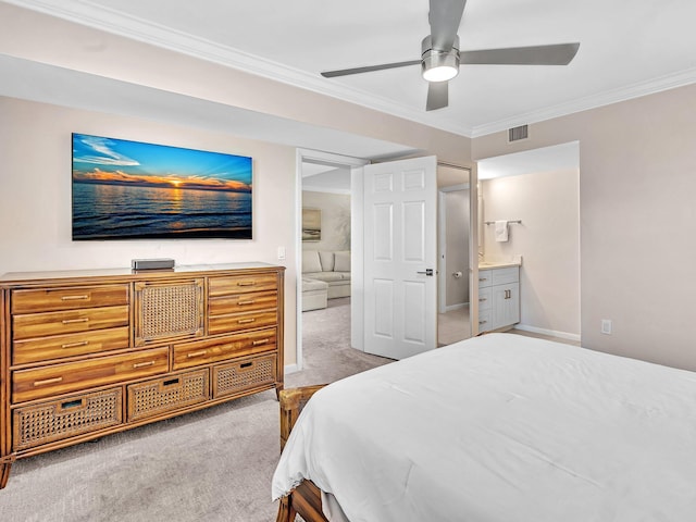 bedroom with crown molding, ceiling fan, ensuite bathroom, and light carpet