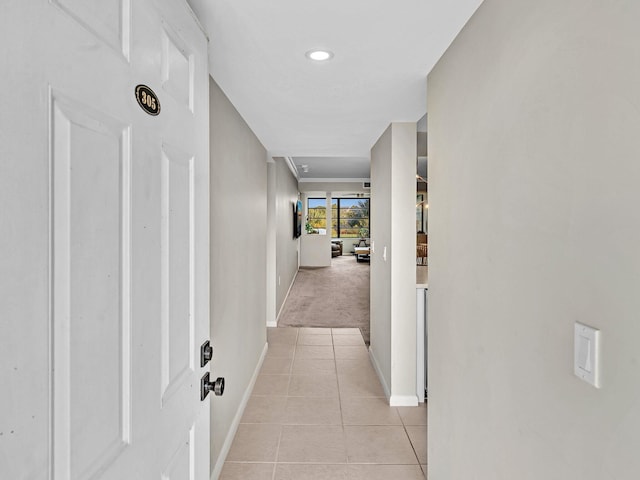 hallway with light tile patterned floors