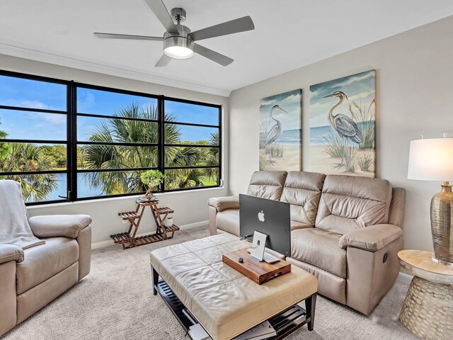 carpeted living room with ceiling fan