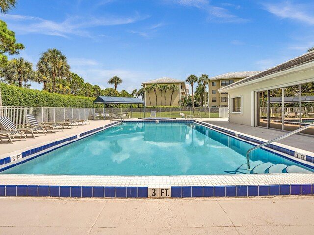 view of swimming pool with a patio area