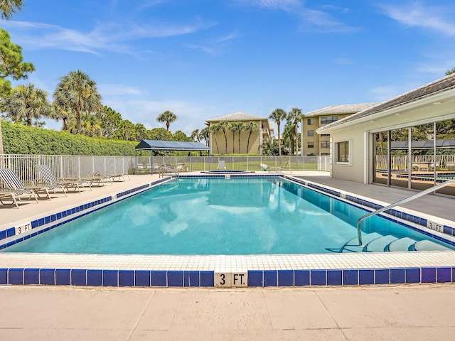 view of swimming pool with a patio area