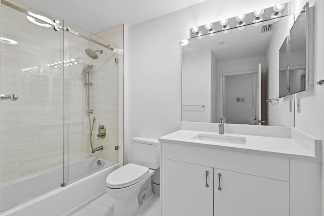 full bathroom with shower / bath combination with glass door, a textured ceiling, tile patterned floors, toilet, and vanity