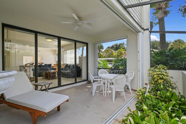 sunroom featuring ceiling fan