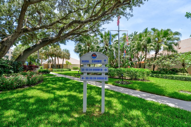 view of property's community with a lawn