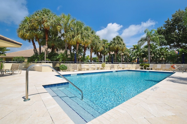 view of swimming pool featuring a patio area