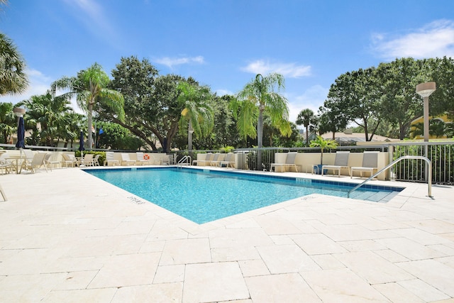 view of swimming pool with a patio