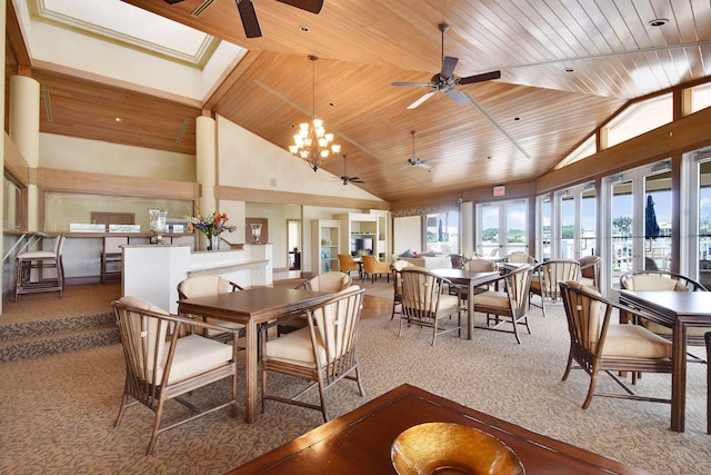 dining room with carpet floors, high vaulted ceiling, wooden ceiling, and ceiling fan with notable chandelier