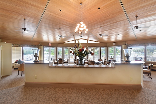 kitchen with ceiling fan with notable chandelier, decorative light fixtures, light colored carpet, and wood ceiling